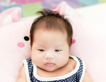 Portrait of adorable baby girl. Isolated on white background with copy spaceの写真素材