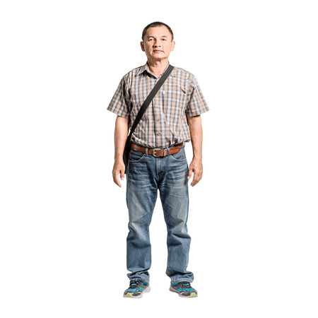 Portrait of a happy mature man standing in scott shirt and blue jeans. Isolated full length on white background with copy space and clipping pathの写真素材