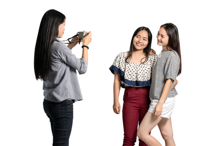 Portrait of a group of friends are taking a photo. Isolated on white background with copy space and...