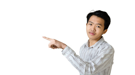 Portrait of a young businessman pointed the finger to left side. Isolated on white background with copy space and clipping pathの写真素材
