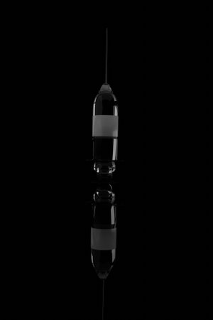 3D rendering.Vaccine against COVID-19 virus cell on black background and reflection. Modern design and realisticの写真素材