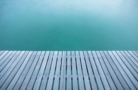 Wooden bridge with blue oceanの写真素材