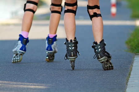 Two girls on the roller skatesの写真素材