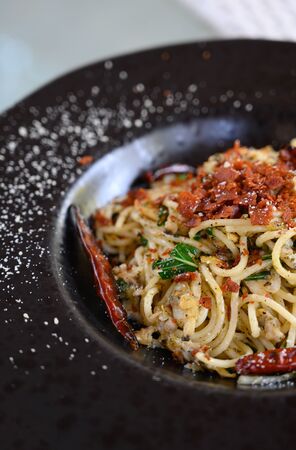 Stir-Fried Spaghetti With Clams, Dried Chili And Crispy Baconの写真素材