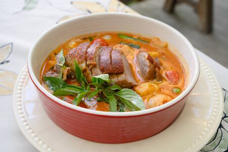 Kaeng Pled Ped Yang (Roasted Duck in Red Curry with tomato,pineapple,Lychee prepared in coconut milk).の写真素材