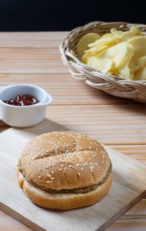 Delicious low fat hamburger and potato chips in basket with ketchup.  Ready to Eat.の写真素材