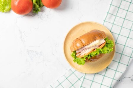 Delicious sandwich with fresh salad, Ham and cheese on white background. Top view with copy space. Flat lay.の写真素材