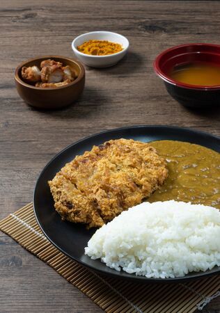 Tonkatsu Curry Rice (Japanese deep-fried pork cutlet with Curry rice) served with karaage (Japanese style fried chicken).の写真素材