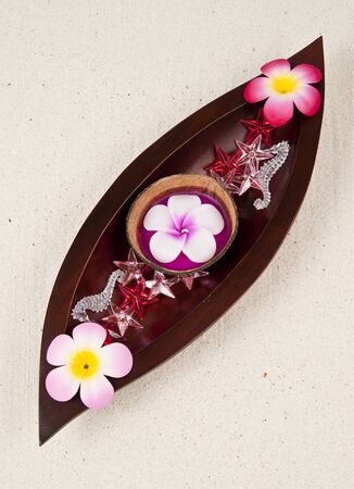 Three flowers in the wooden leaf trayの写真素材