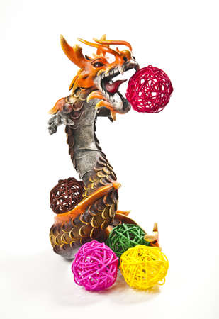 Orange dragon with colorful weave ballsの写真素材