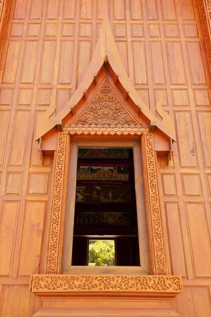 Windows of modern Thai teak templeの写真素材