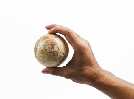 Holding world map isolated on white backgroundの写真素材