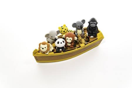 Group of animals in the small yellow boatの写真素材