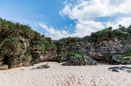 Mountain along white sand beachの写真素材
