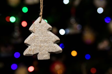 Tree shape of Christmas ornaments hanging on Christmas treeの写真素材