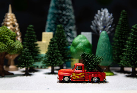 One red truck car with Christmas tree at the back