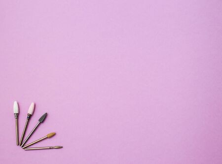 Top view of manicure and pedicure equipment on pink horizontal background with copy spaceの写真素材