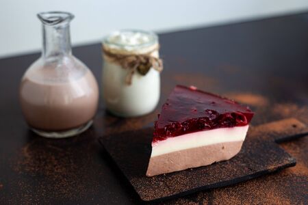 Diet layered dessert blancmange made from soy milk, carob and fruit jelly with cherry and black...