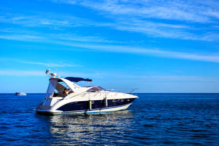 Motorboat in the sea against blue sky. Seascape