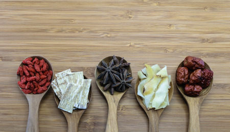Essential chinese herbal ingredients for cooking chinese soup. From left: Chinese Wolfberries (Gou Ji Zi),  Astragalus root (Huang Qi), Chinese star anise, Solomon Real Rhizome (Yu Zhu Pian), Red dates (Hong Zao)の写真素材