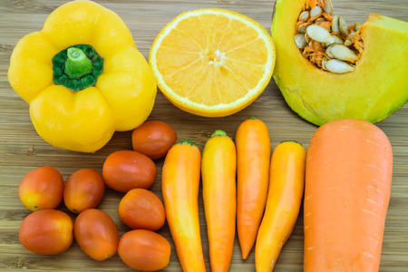 Variety of Orange color fruits and vegetables which are a good source of beta-caroteneの写真素材