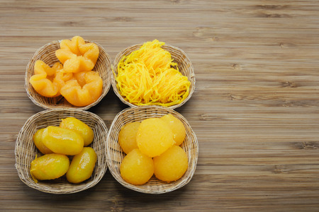 Four differnt kinds of Auspicious traditional Thai desserts are also known as  "pinched gold egg yolks"の写真素材