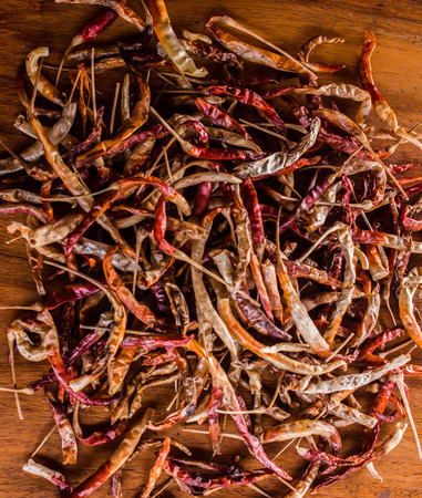 Dried chilli on the brown background.の写真素材