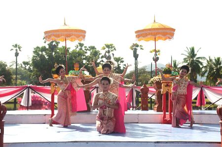 SUKHOTHAI, THAILAND - NOVEMBER 10  A group of Thai dancers perform Thai dance in the occasion of Loy Krathong festival on November 10,2011 in Sukhothai, Thailand  のeditorial素材