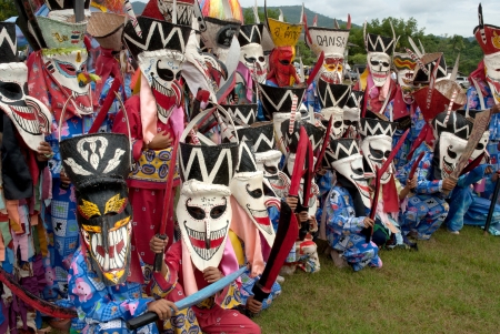 LOEI, THAILAND - JULY 1  Unidentified young people dress in spirit and wear a mask, sing and dance Phi Ta Khon Festival   Ghost mask festival   on July 1, 2011 in Loei, Thailand のeditorial素材