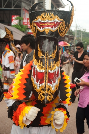 LOEI ,THAILAND-JUNE 23  Large Ghost Mash parade around church in the temple  Phi Ta Khon festival   is a type of masked procession celebrated on Buddhist merit- at Loei province,June 23,2012 のeditorial素材