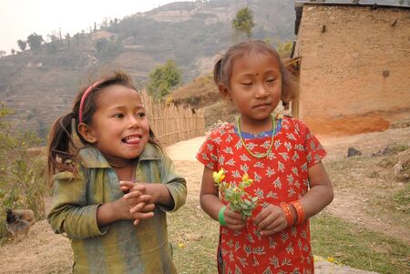NAGAGROT, NEPAL - MARCH 16  Two unidentified tibetan girls from village of Tibetan refugees on March 16, 2012 in Nagagrot District, Nepal  のeditorial素材