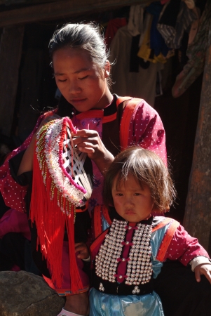 CHIANG MAI, THAILAND - JAN 22   Yao family with traditional clothes and silver jewelery in Yao hilltribe minority village on January 22, 2011 in Chiang Mai, Thailand  のeditorial素材