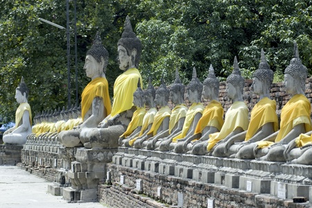 Group of ancient sitting Buddhas in Wat Yai Chai Mong Klong temple in Ayuttaya,Middle of Thailand の写真素材