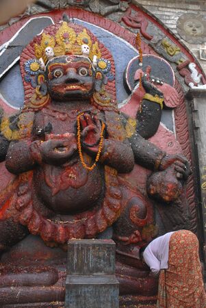 Woman Praying at Kali in Kathmandu, Nepal  の写真素材