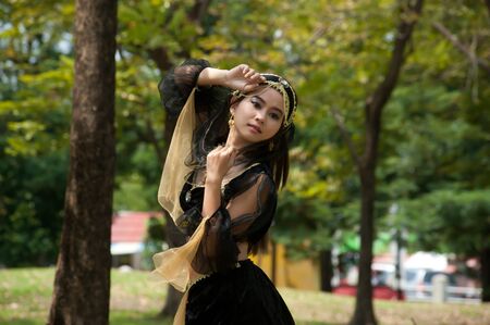 Pretty Asian woman in black Indian clothes in posing の写真素材