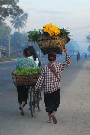 A woman monger go to market in Myanmar のeditorial素材