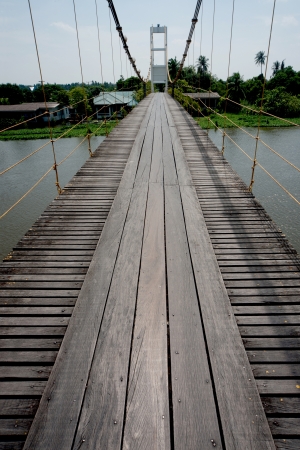 Hanging bridge across the river in Thailand  の写真素材