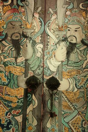 Ancient painting Chinese guardians on the door in Wat Pho temple,Bangkok in Thailand のeditorial素材