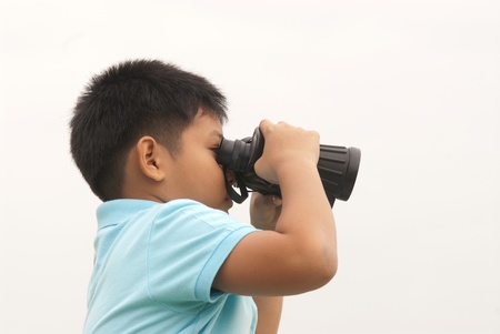 Young boy with binocular の写真素材