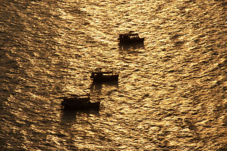 Boats in the the sea at Sunset  の写真素材