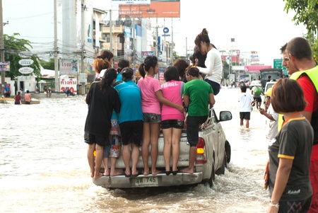 AYUTTHAYA, THAILAND - OCTOBER 9  Heavy flooding from monsoon rain in Ayutthaya and north Thailand arriving in Ayutthaya suburbs on October 9, 2011 in Ayutthaya, Thailand のeditorial素材