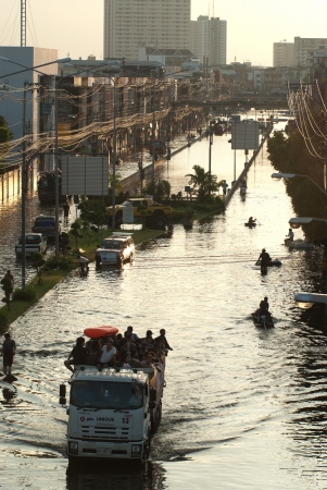 BANGKOK, THAILAND-OCTOBER 30  Transportation of people in the streets flooded after the heaviest monsoon rain in 50 years in the capital on October 30, 2011 Phahon Yothin Road, bangkok, Thailand  のeditorial素材