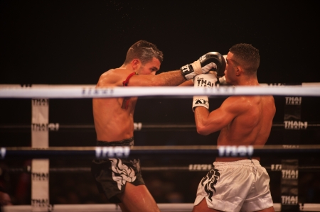 BANGKOK, THAILAND-NOV 27  Unidentified fighters fight Muaythai at Thai Fight Muay Thai    The World s Unrivaled Fight at Imperial Departmaent Store stadium on November 27, 2011 in Bangkok,Thailand  のeditorial素材