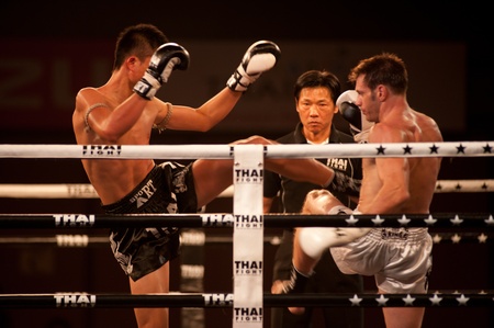 BANGKOK, THAILAND-NOV 27  Unidentified fighters fight Muaythai at Thai Fight Muay Thai    The World s Unrivaled Fight at Imperial Departmaent Store stadium on November 27, 2011 in Bangkok,Thailand  のeditorial素材