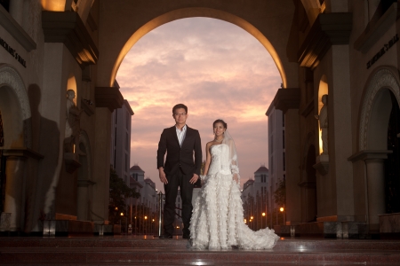 A beautiful Asian bride and handsome groom at Christian church during wedding の写真素材