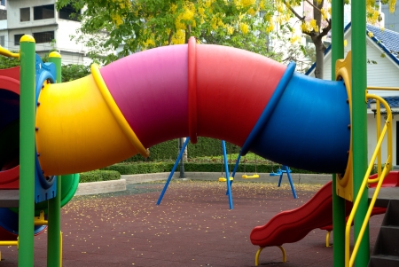 Colorful spiral tube slide at public playground の写真素材