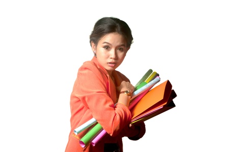 Busy Asian business woman with a lot of folders and papers ,isolated on white background  の写真素材