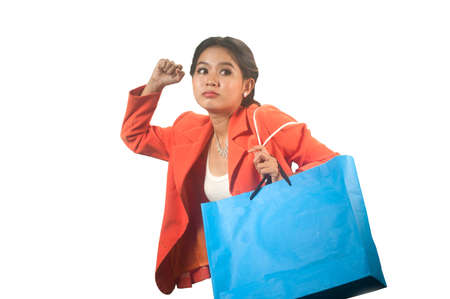 Young Asian business woman with shopping bags isolated on a white background  の写真素材