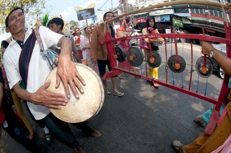 Traditional musicians hitting long drum and gongs around in Poy Sang Long Festival parades in Thailand のeditorial素材