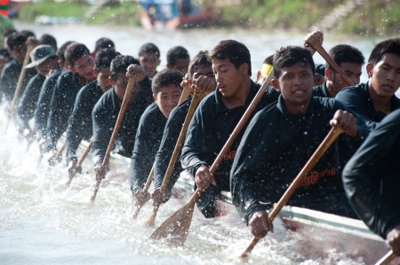 Chumphon ,Thailand-November 3,2012   Unidentified rowers enjoy  in Climbing Bows toward Snatching a Flag native Thai long boats compete during King s cup Native Long Boat Race Championship on November  3, 2012 in Chumphon Province ,Southern of Thailand のeditorial素材